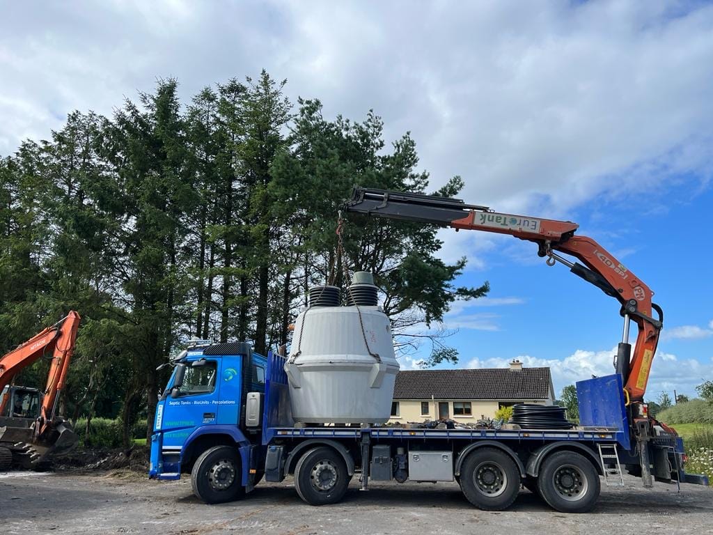 septic tank being transported on truck